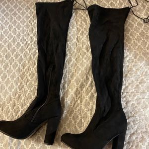 Rue 21 long heeled boots. Never worn, not very stretchy, soft material!